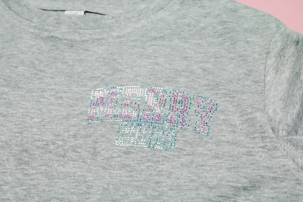 Close up of small Spangle DTF transfer on shirt.