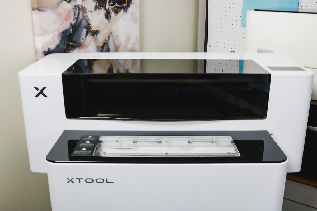 xTool apparel printer with shaker oven in front/under.