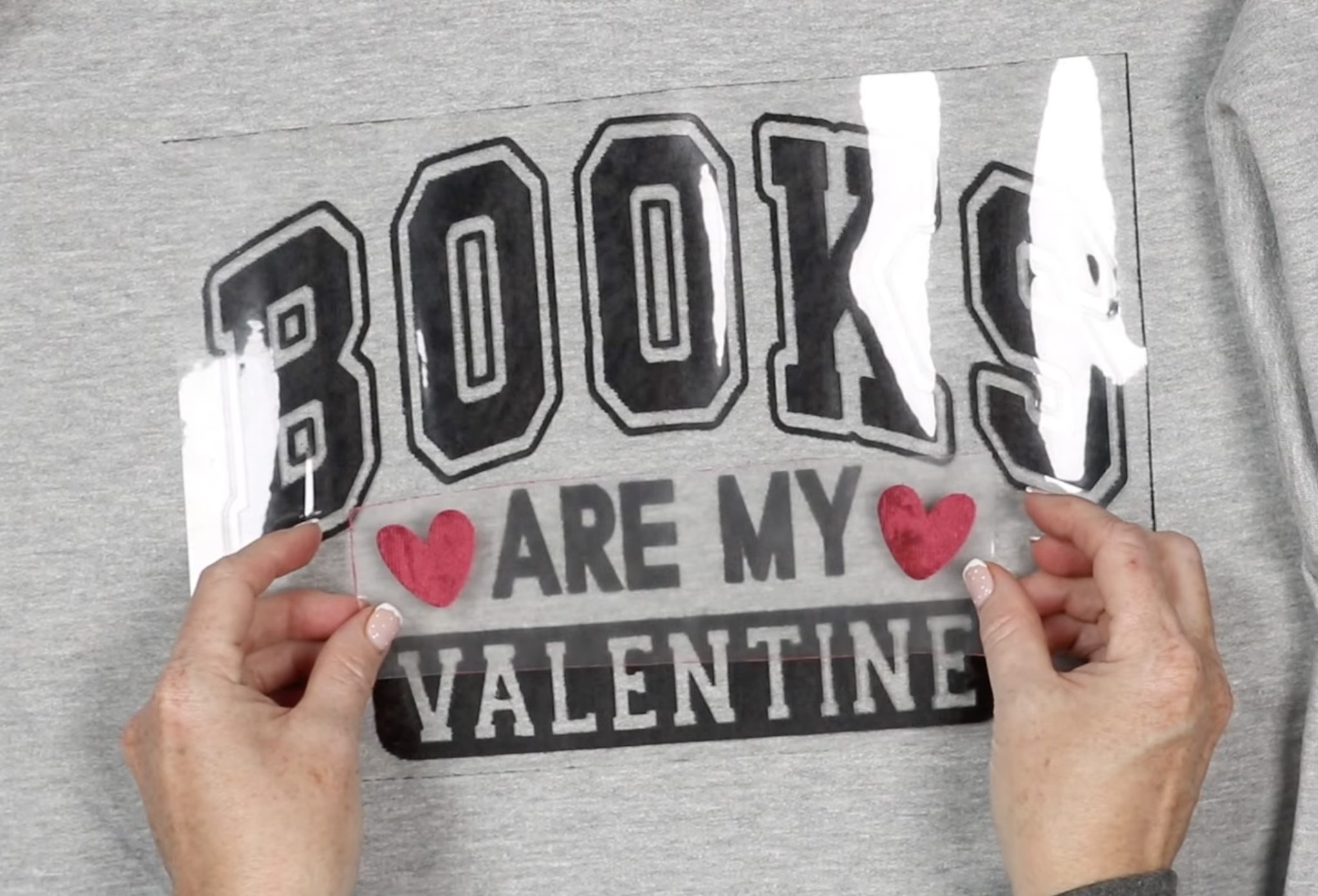 Locate black layer on sweatshirt.