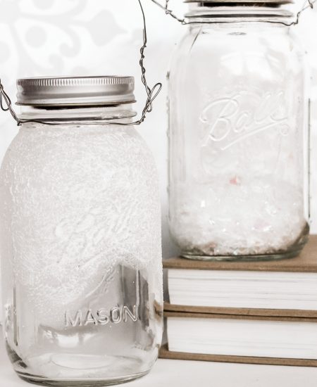 Jars with paint and with fake snow to make solar lights
