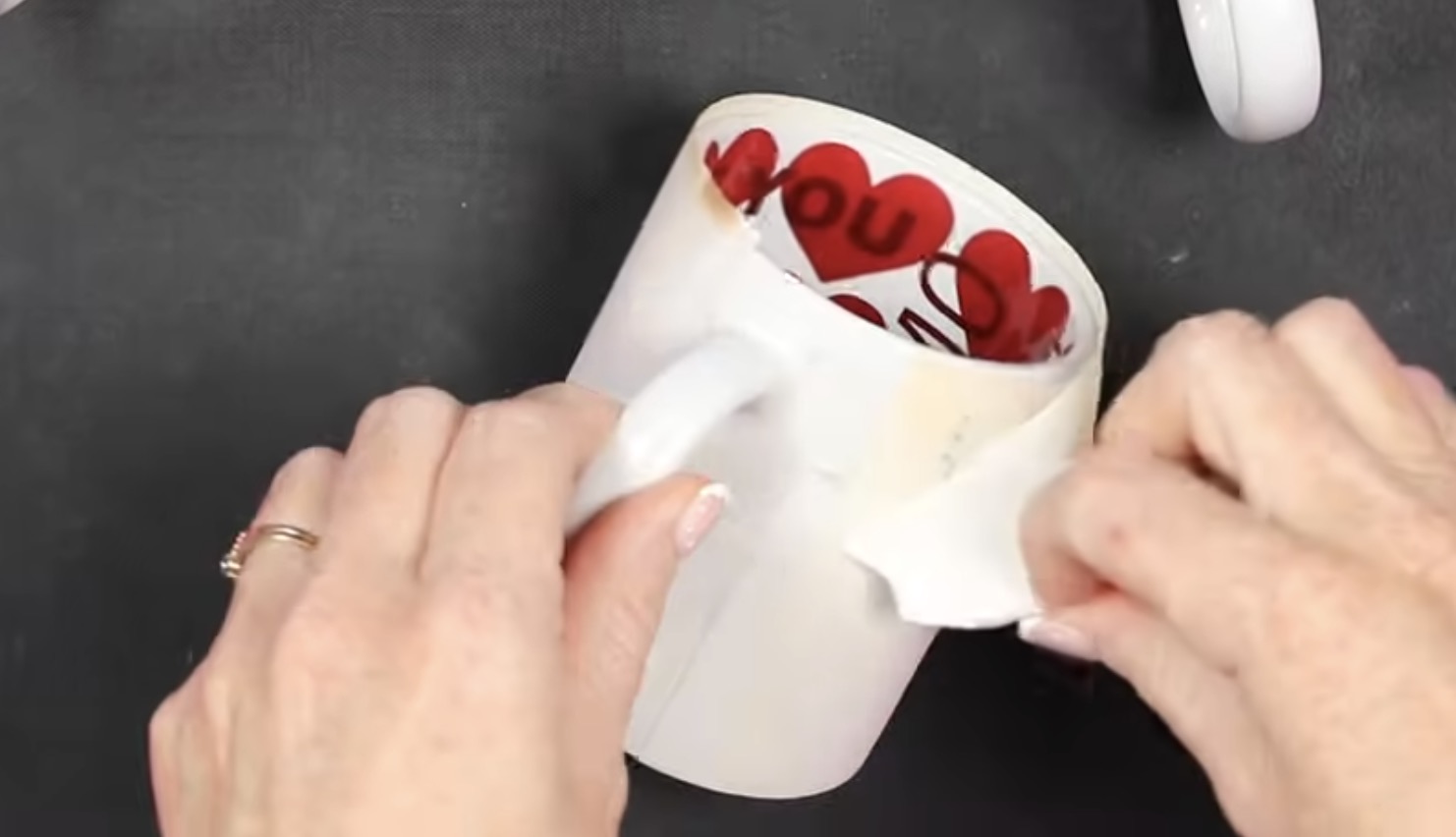 Remove protective paper and sublimation print from mug.