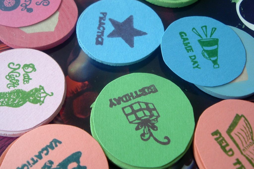 paper circles on painted wooden discs