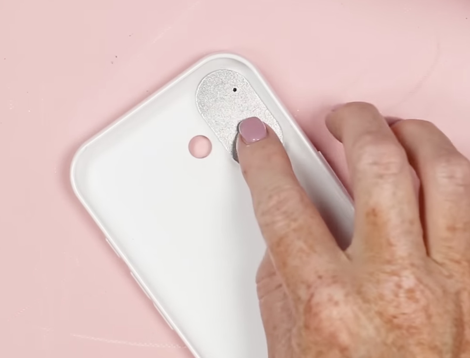 Add tabs to cover holes in phone case.