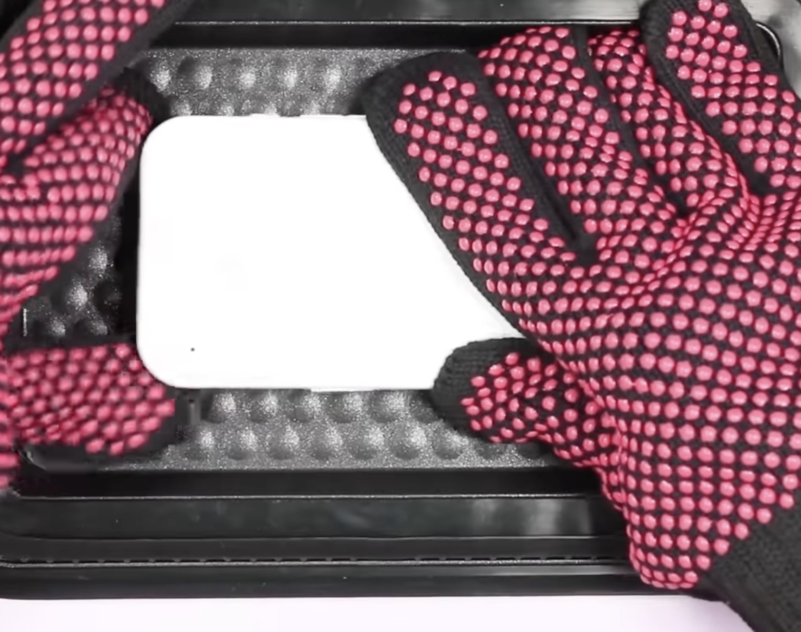 Place phone blank on fixture inside heat press.