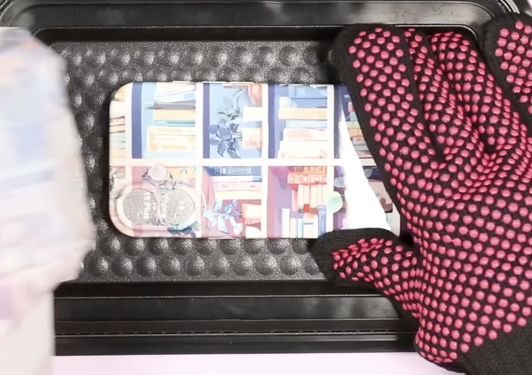 Remove finished phone case from the heat press.