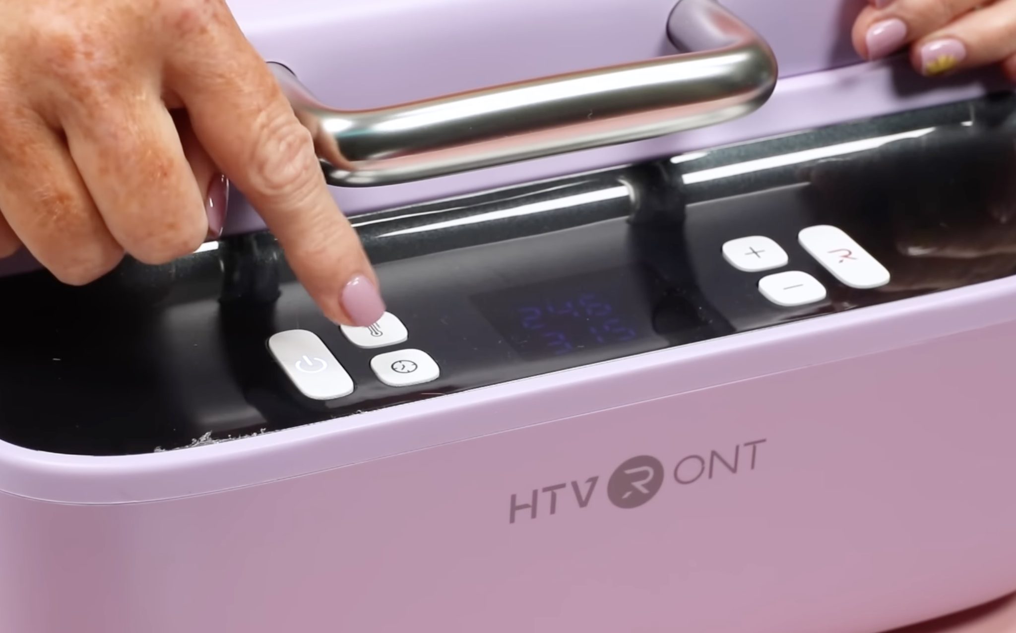 Close up of buttons on the phone case heat press.