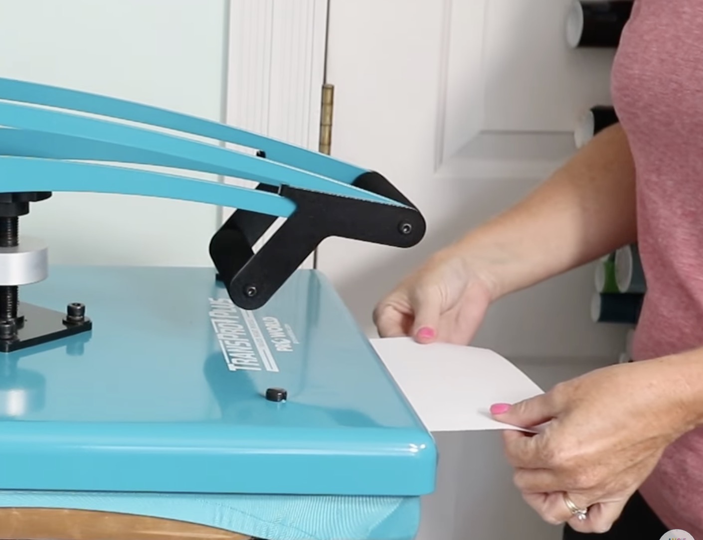 Add paper to the front of the heat press leaving some hanging out.