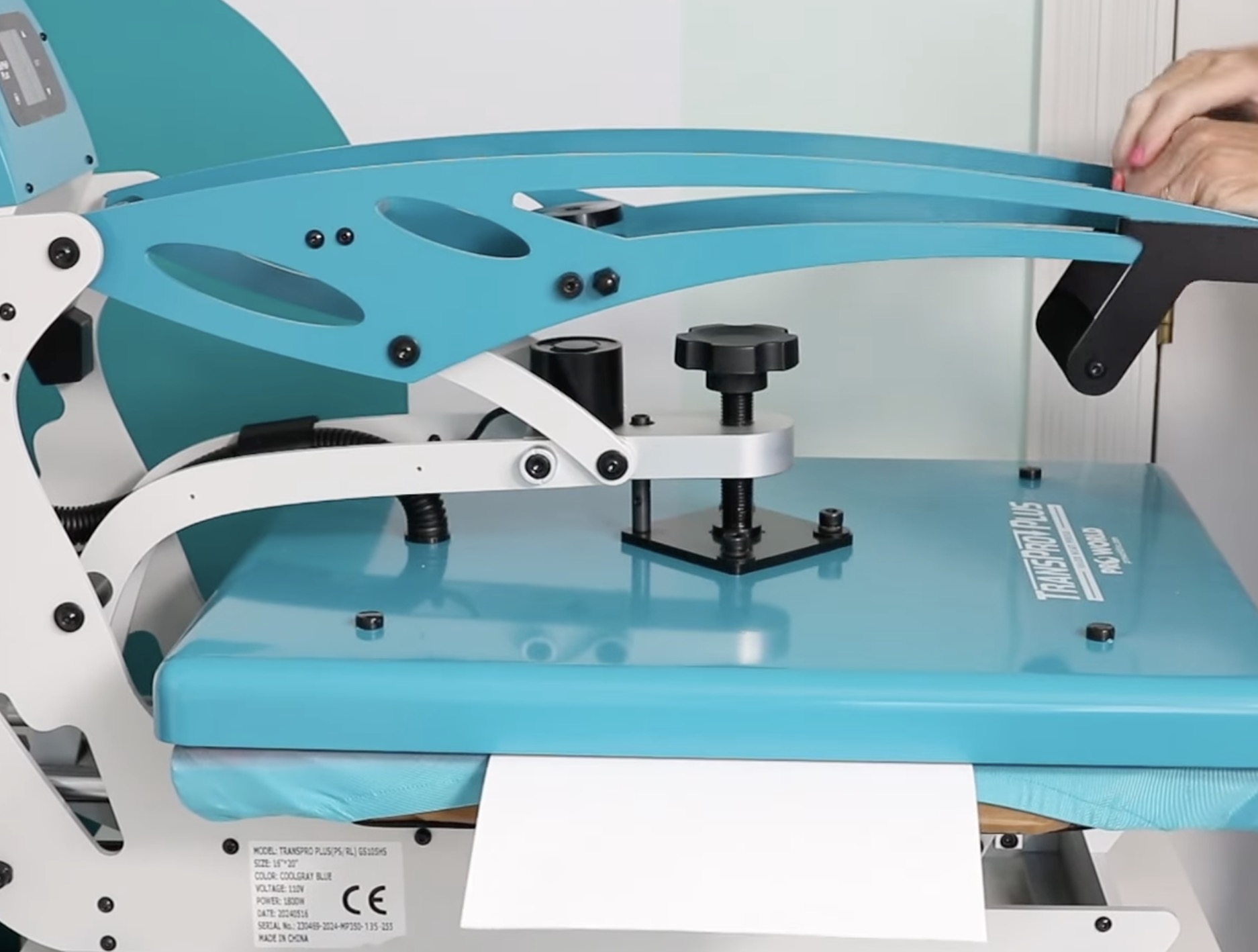 Add copy paper to the side of the heat press.