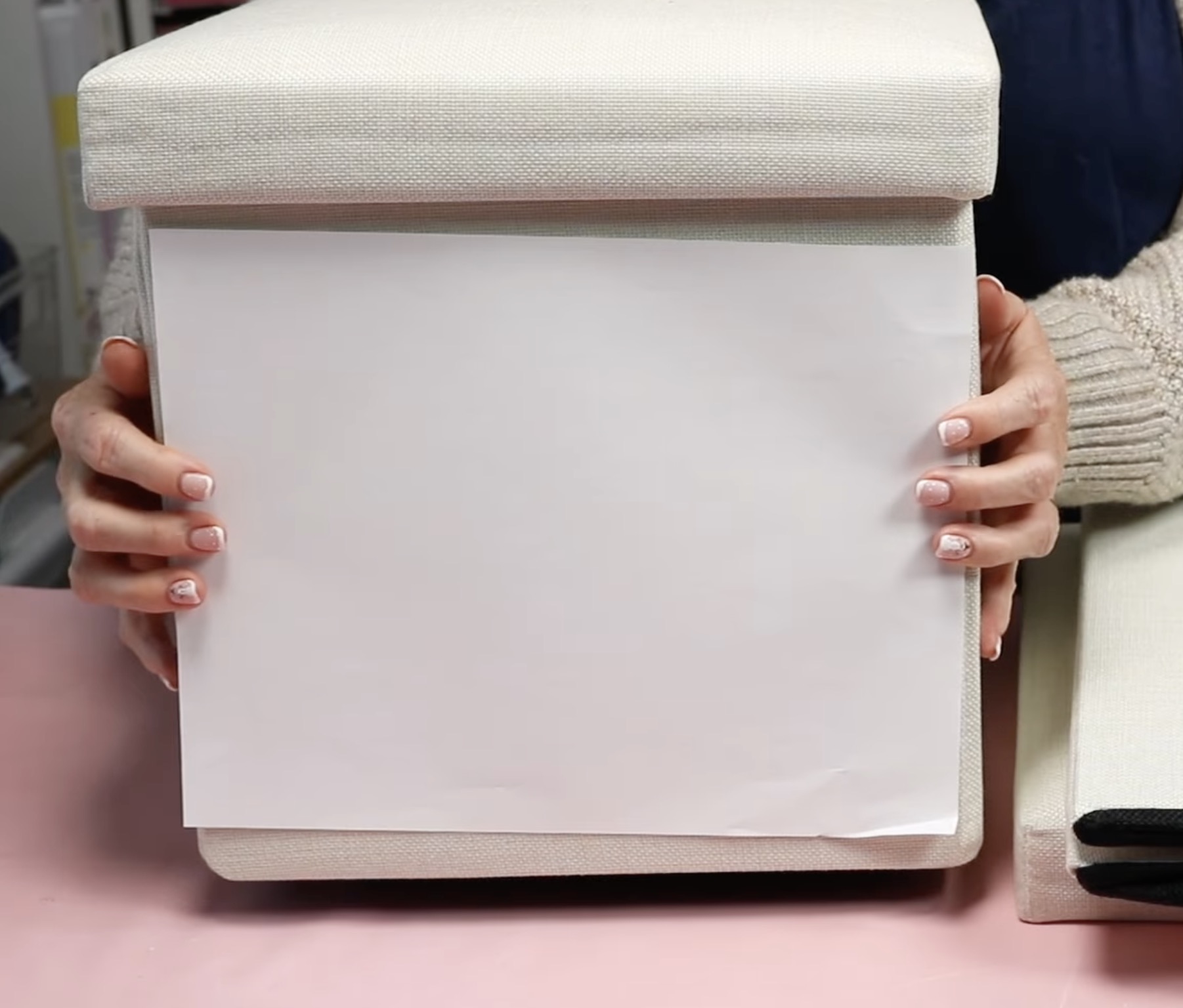 Sublimation bin with paper measured to side.