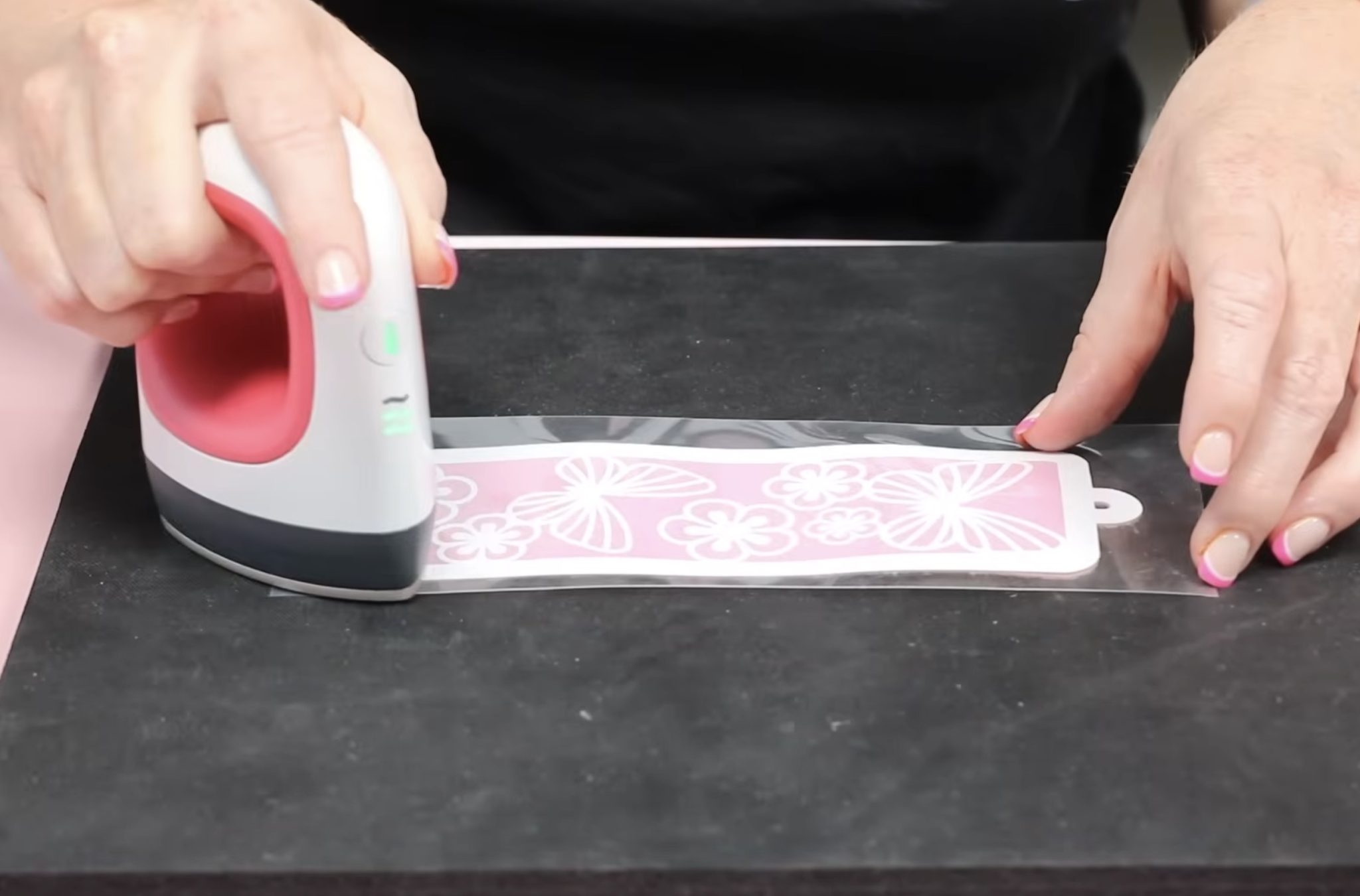 Press HTV on faux leather bookmark.