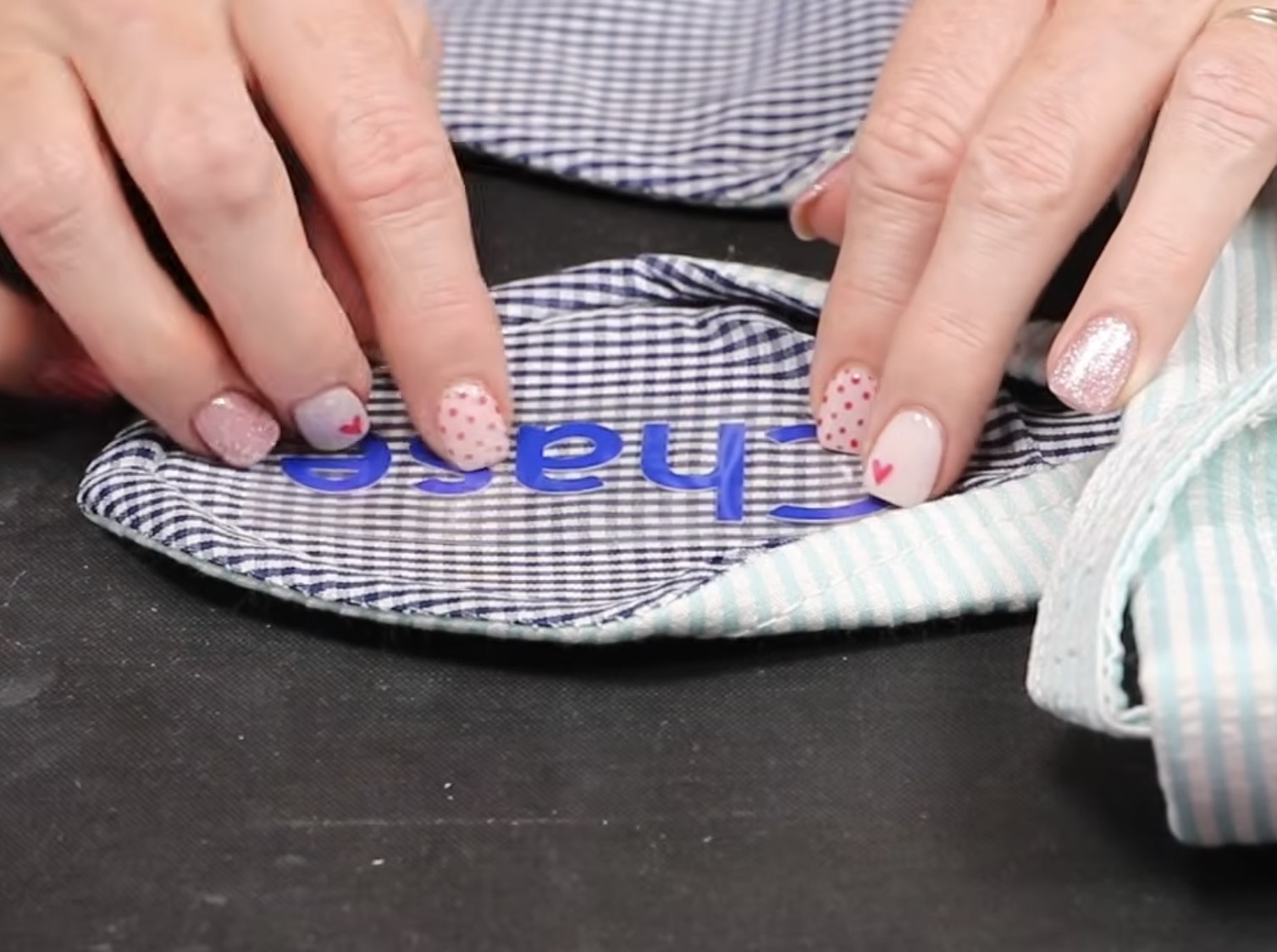 Locate text HTV on Easter basket ear.