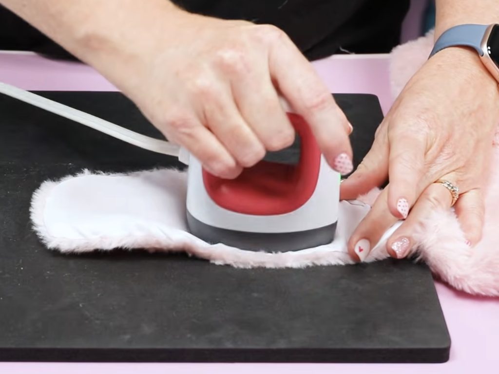 Preheat fabric with EasyPress Mini.