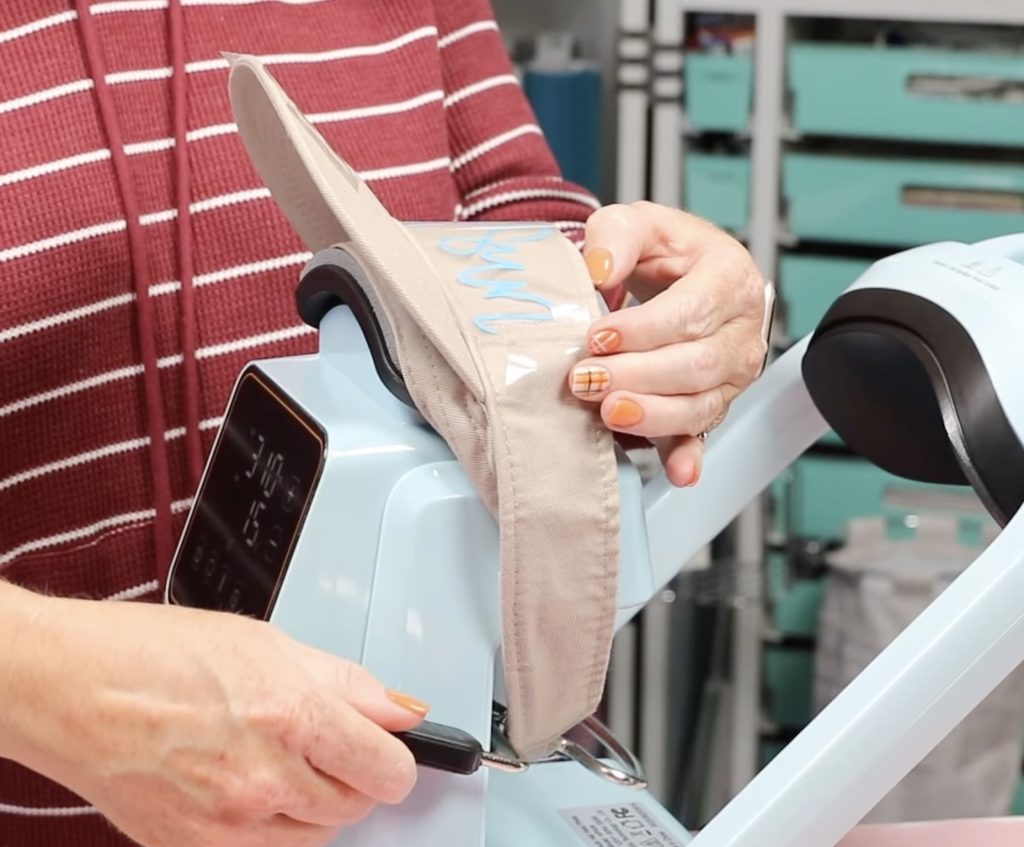adding puff htv to front of hat in the htvront hat press
