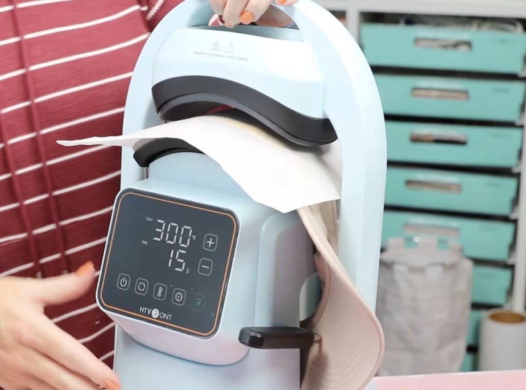 pressing side of hat in the hat press