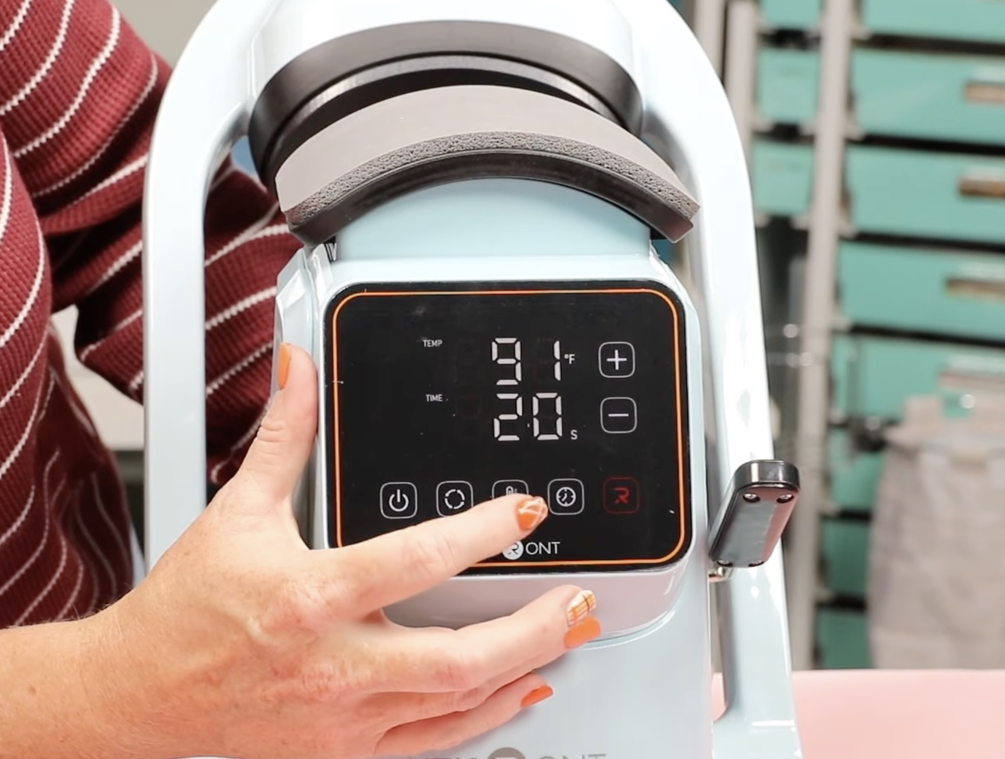 Adjust time and temperature on the HTVRont Auto Hat Press.