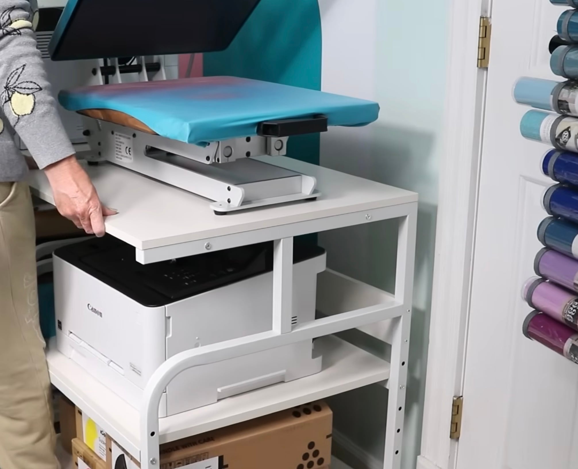 Heat press and printer storage shelf.