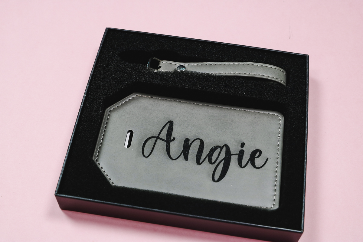 Leatherette luggage tag in packaging.