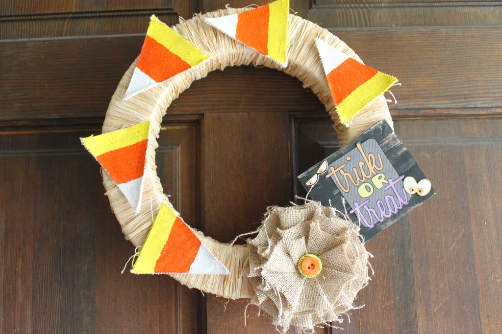 Wreath with candy corn and trick or treat sign