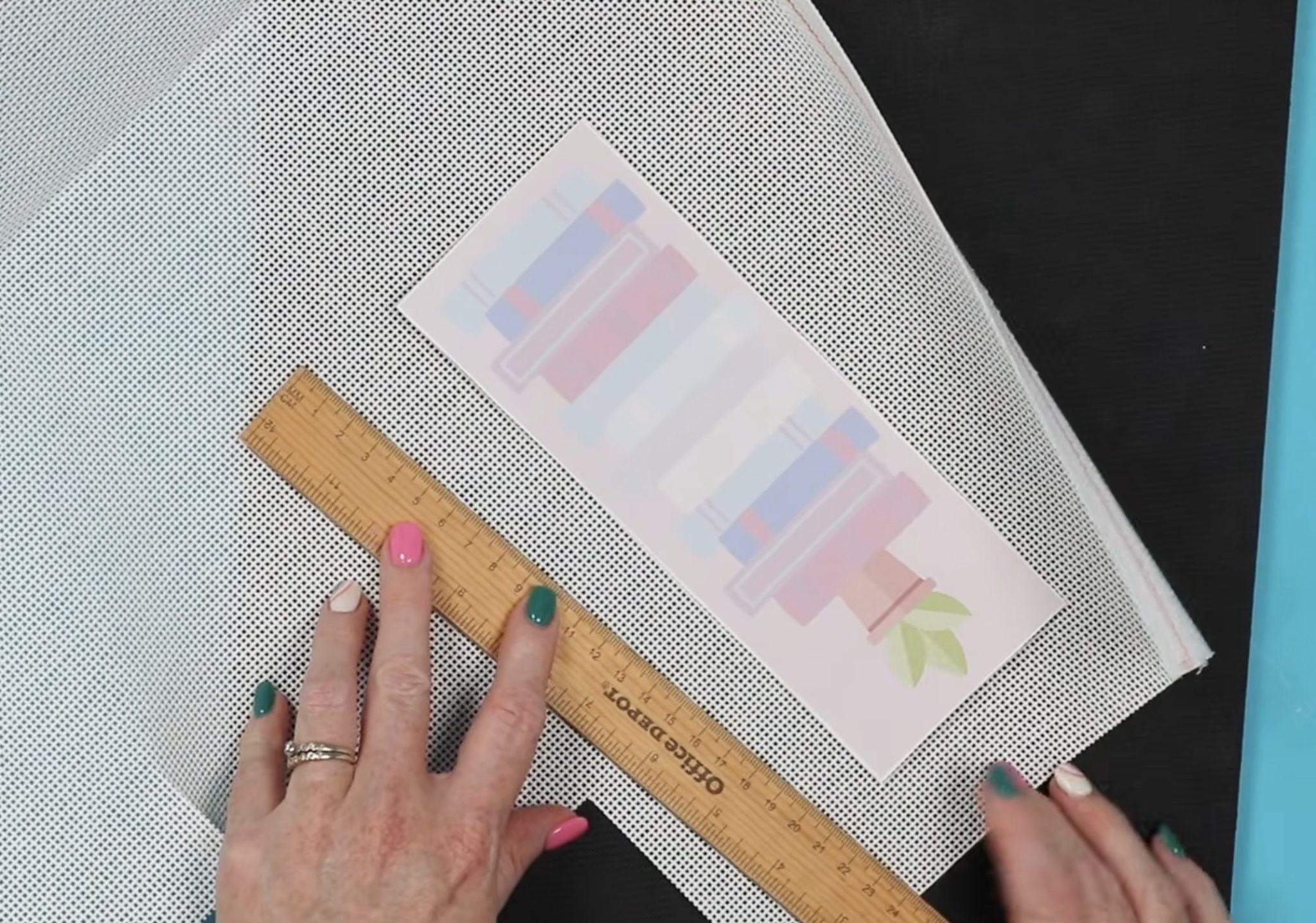Use a ruler to measure the needlepoint canvas.