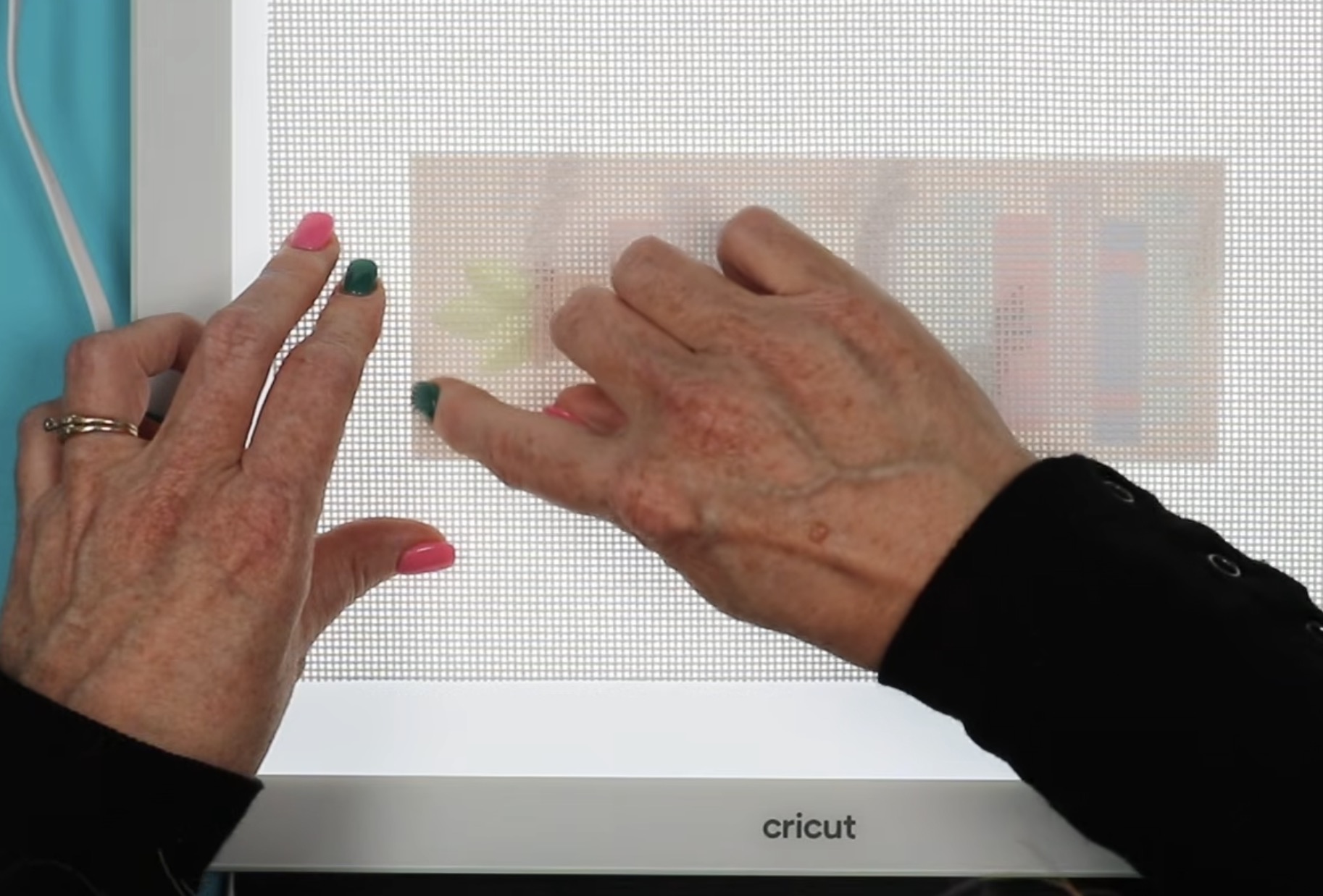 Line up the edge of the print with the squares of the needlepoint canvas.