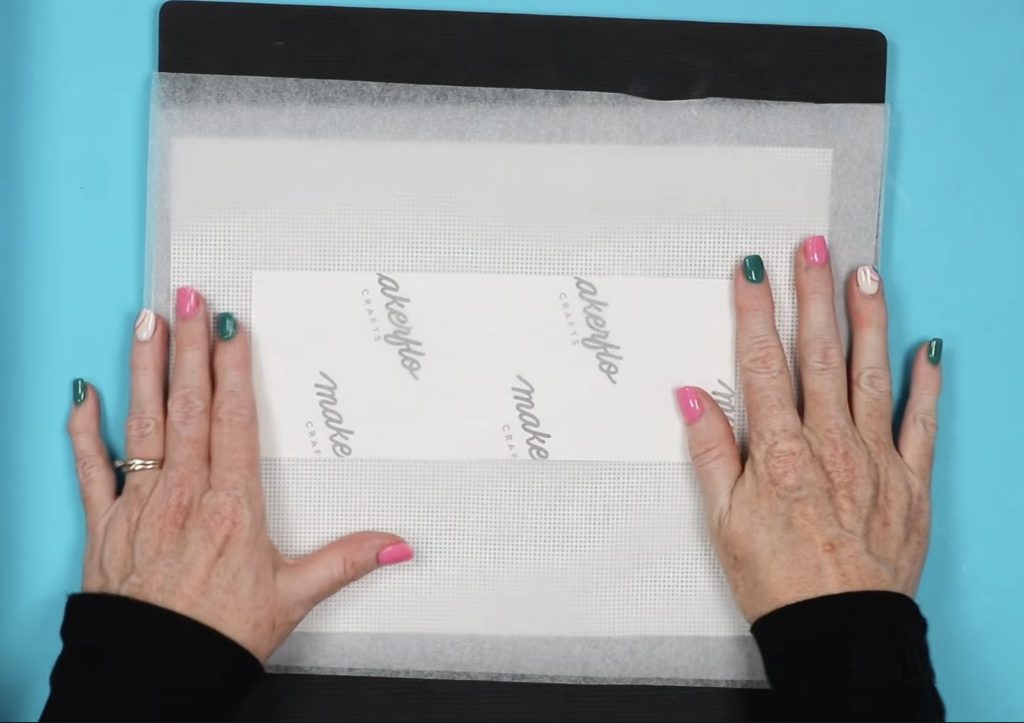 Cover print with protective paper on heat-resistant mat.