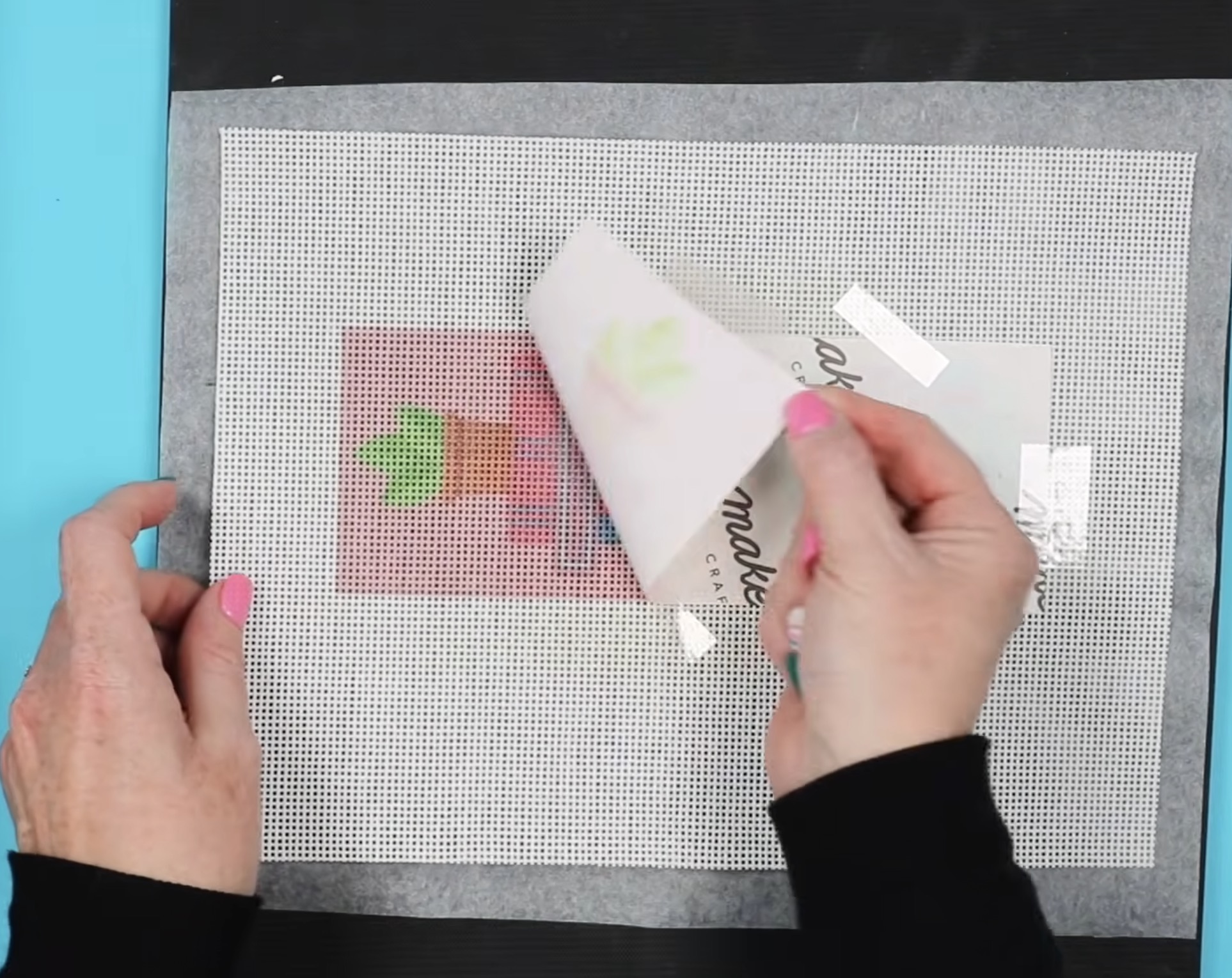 Remove sublimation print from needlepoint canvas.