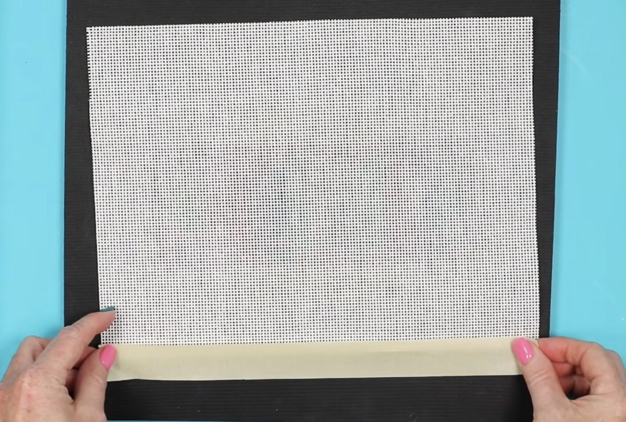 Add masking tape to canvas edges.