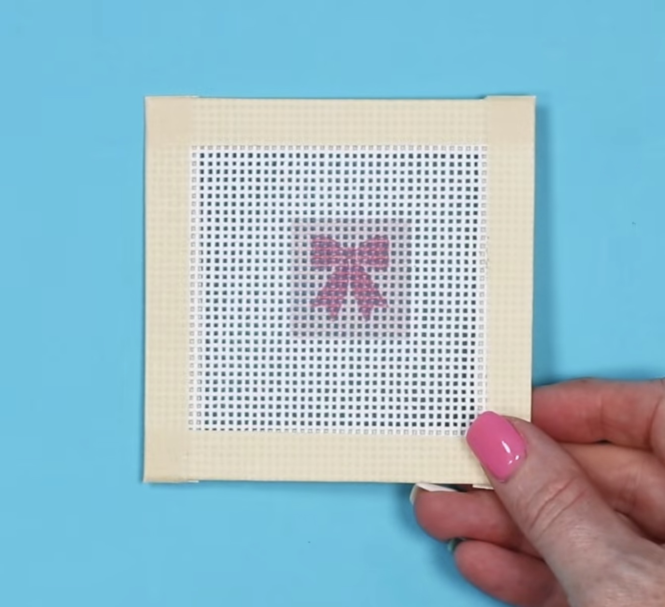 Small needlepoint sublimation canvas with pink bow.