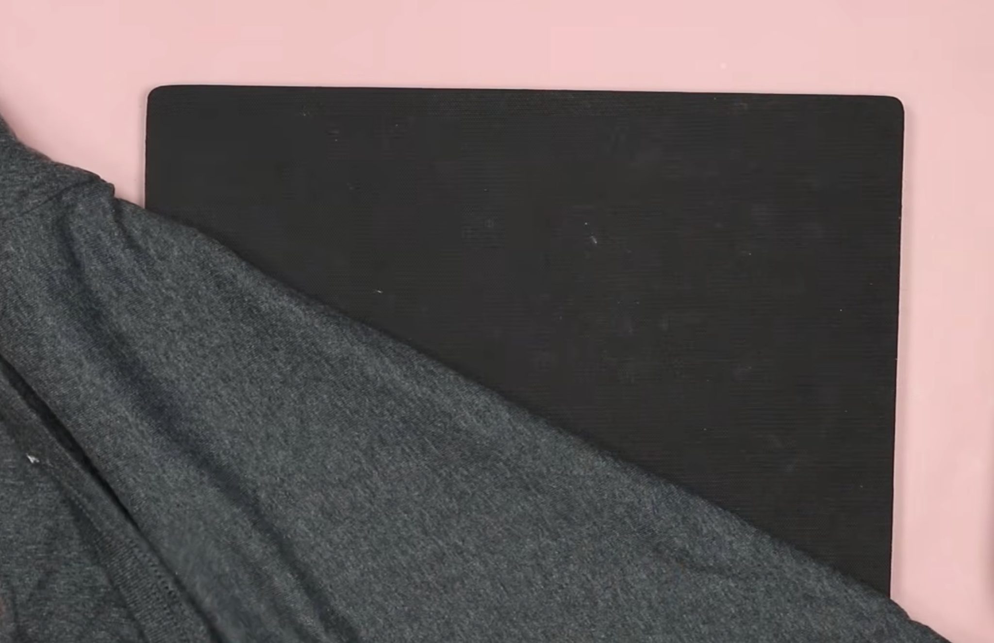 Add shirt to heat-resistant mat.