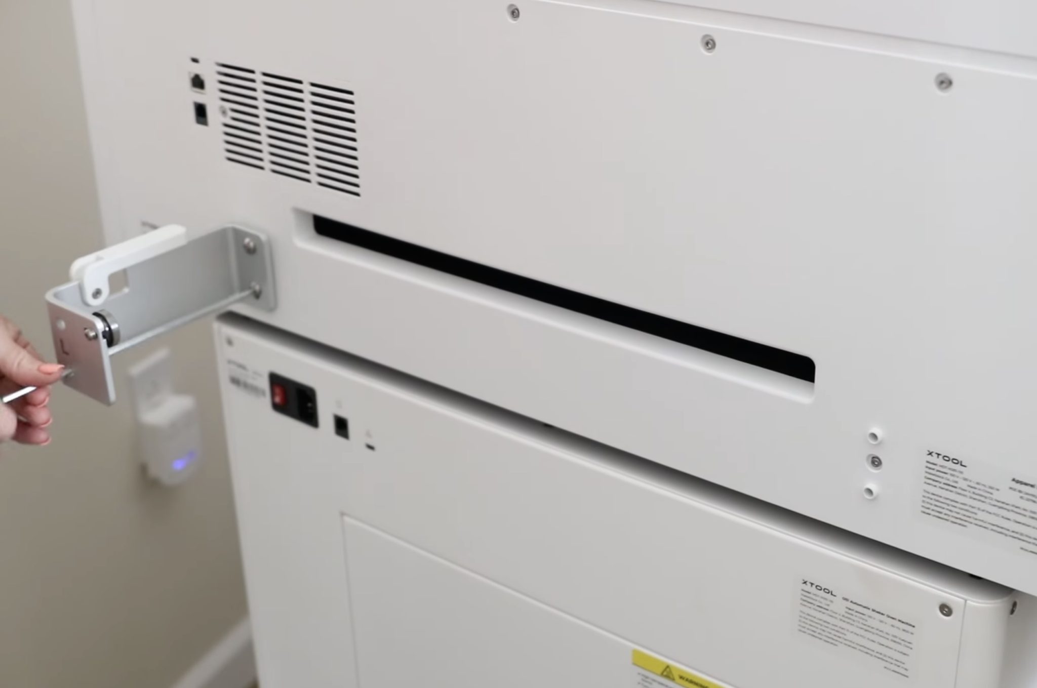 Add roll brackets to the back of the printer.