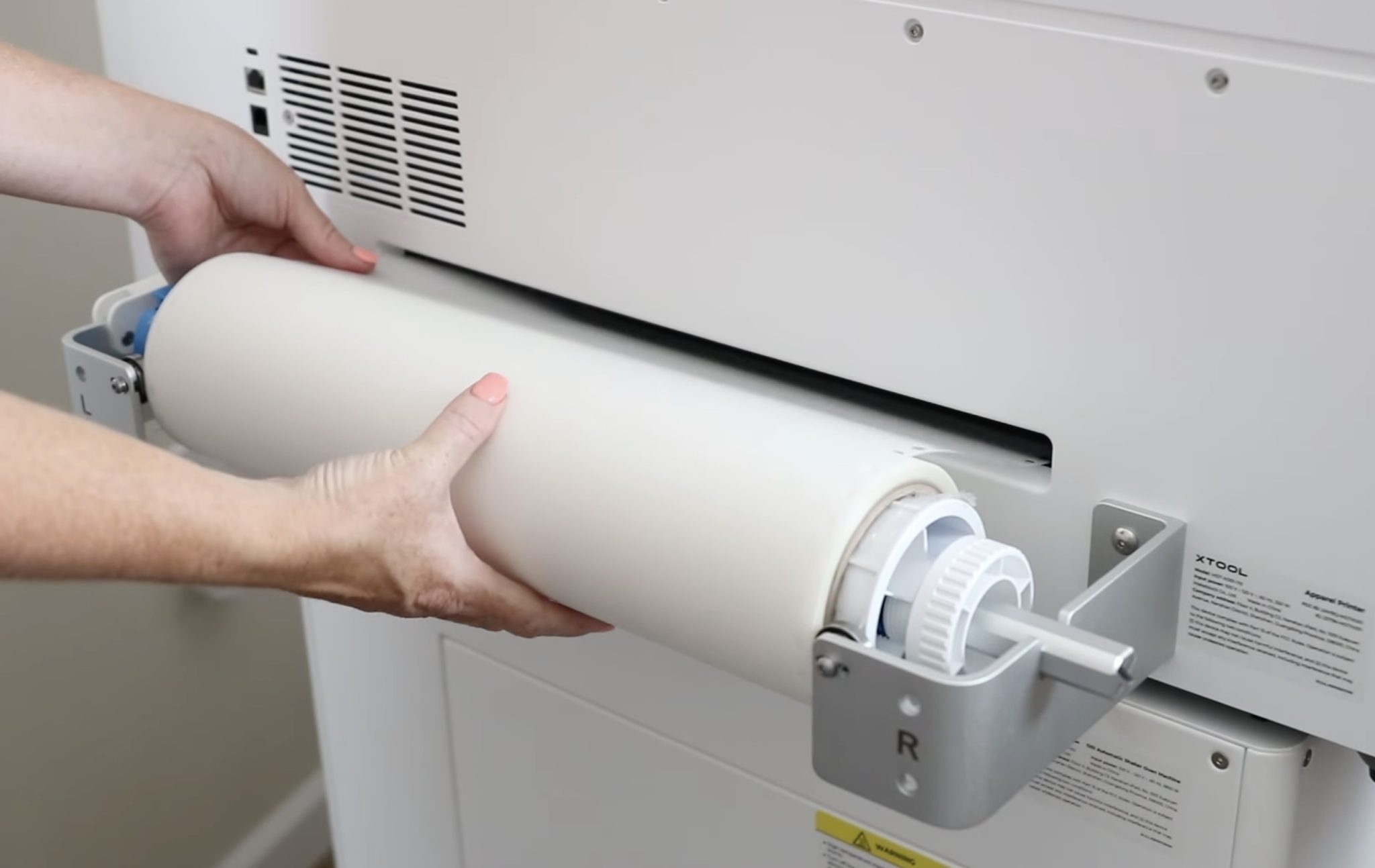 Close lever to hold roll in place.