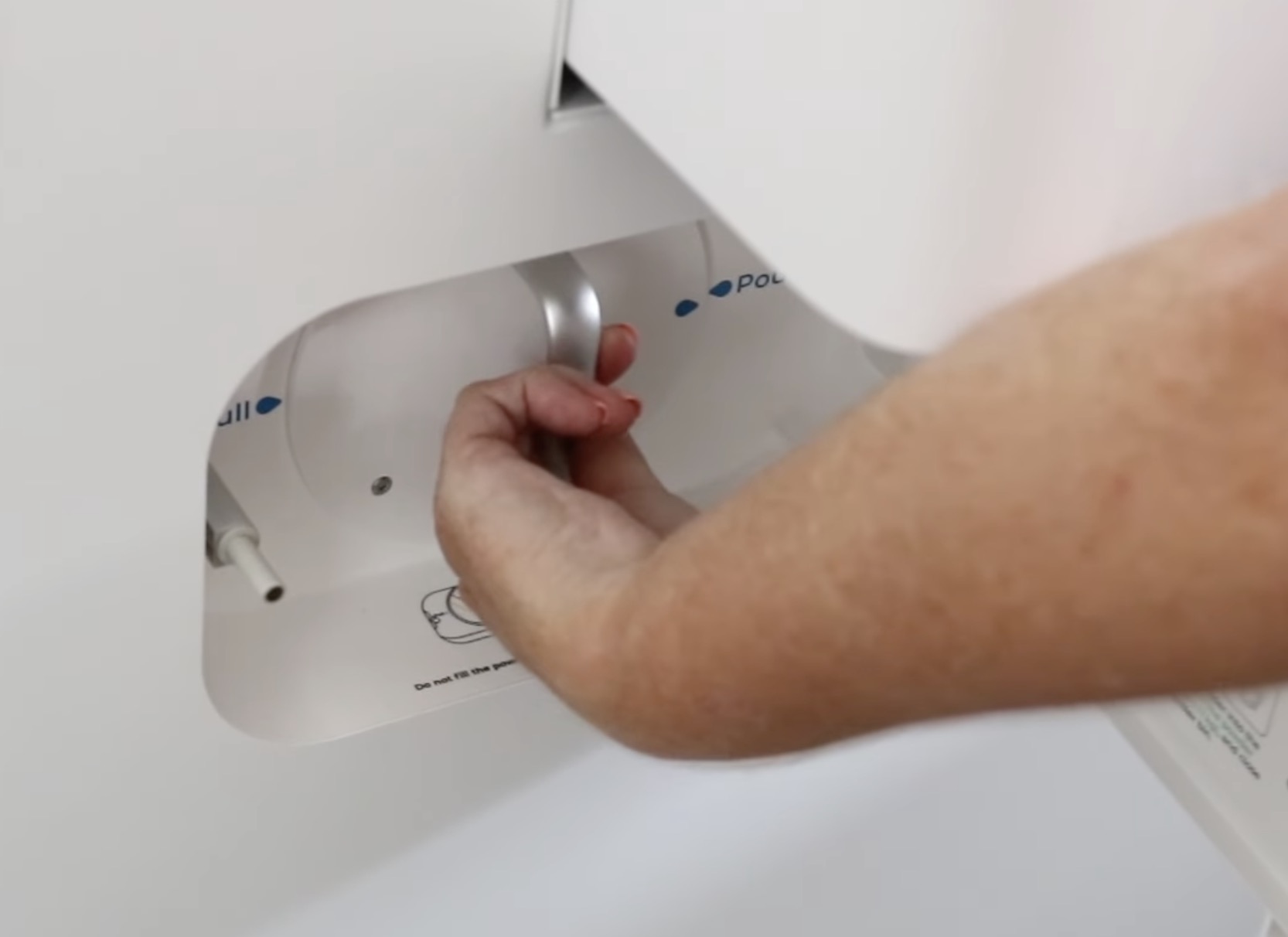 Rotate handle to pour adhesive into shaker oven.