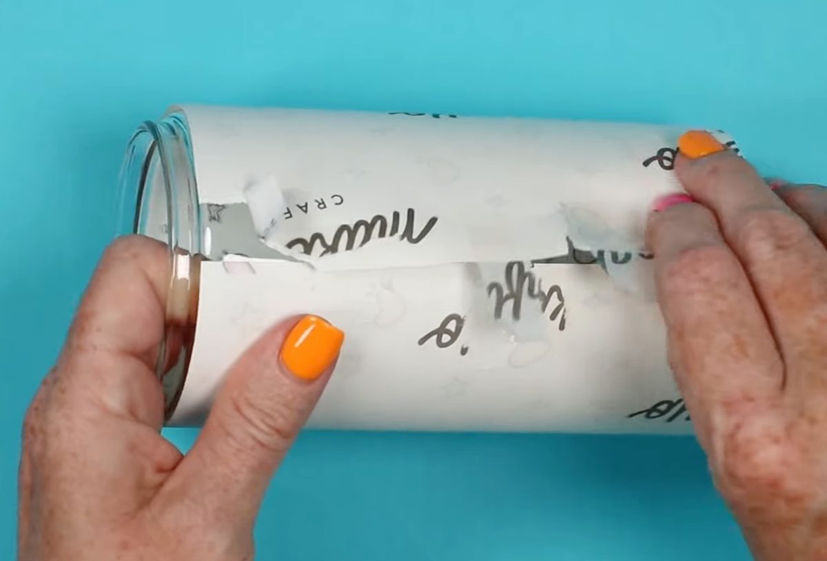 Remove sublimation print from glass can.