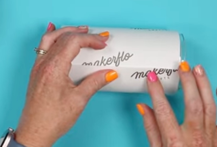 Wrap sublimation print around glass can.