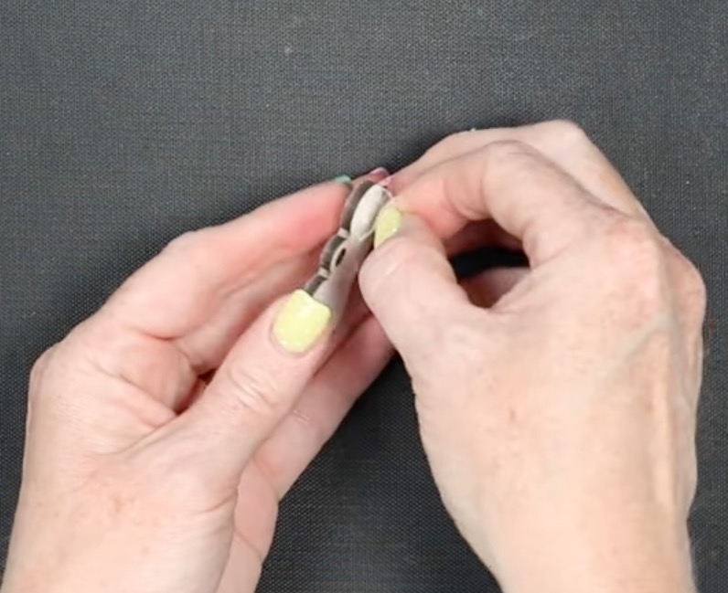 Remove protective film from the dog tag.