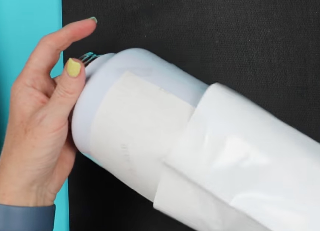 Place tumbler inside shrink sleeve.