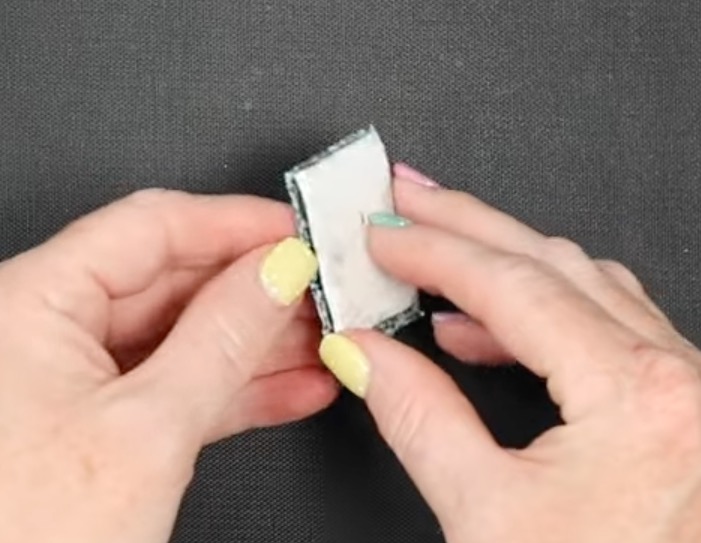 Remove sublimation print from dog tag.