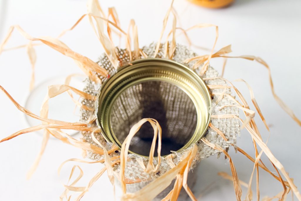 adding burlap and raffia to a jar