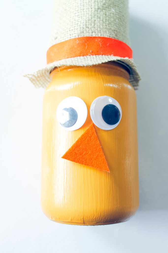 eyes and nose added to painted mason jar