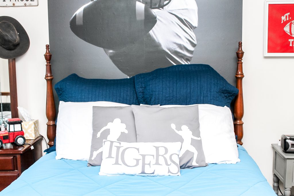 Sports themed bed with football pillows