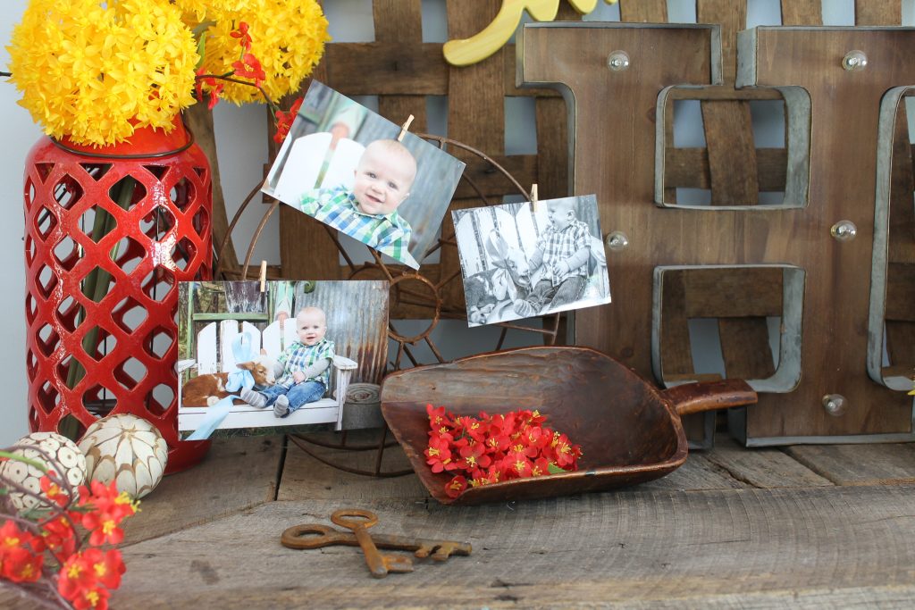 Adding faux flowers to a mentel for summer