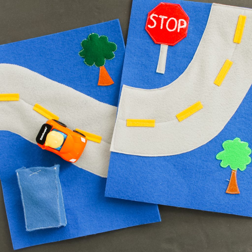 felt pages with a road and trees