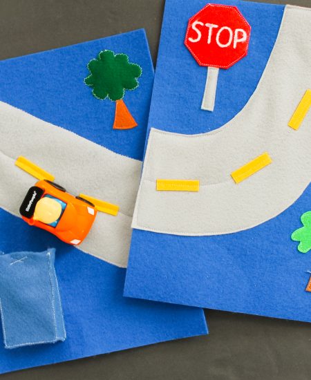 felt pages with a road and trees