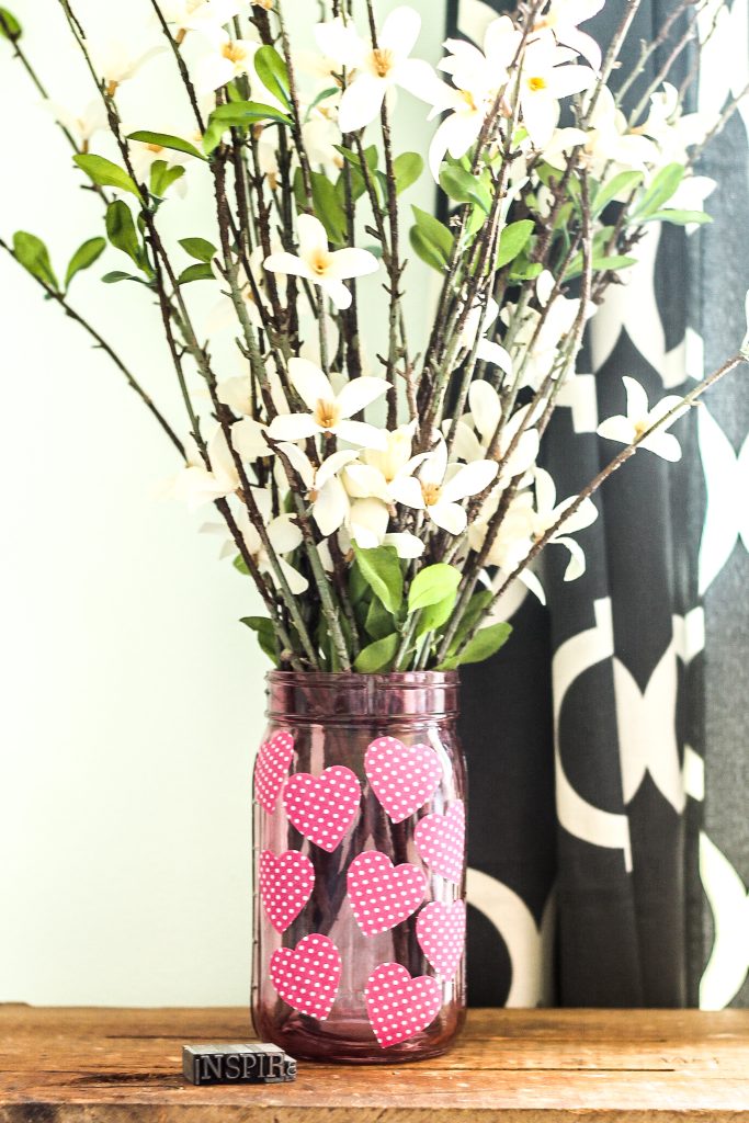 flowers in a decorated mason jar