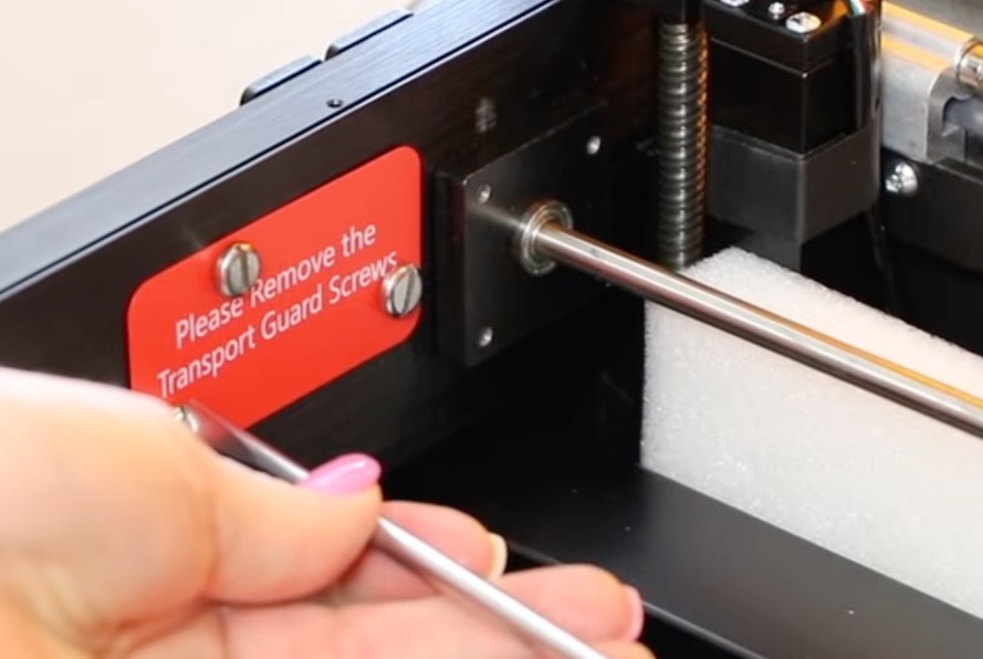 Remove transport screws and guard.