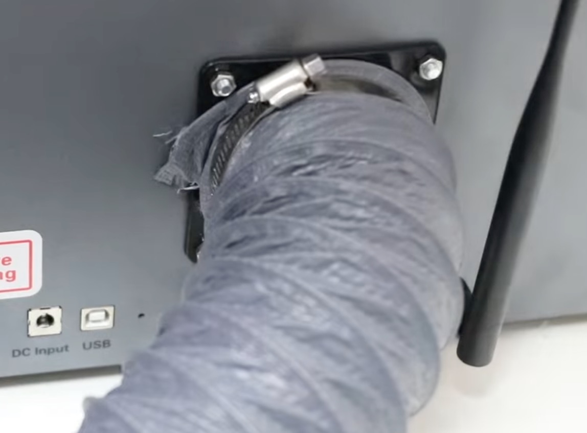Attach vent hose to the back of the laser.