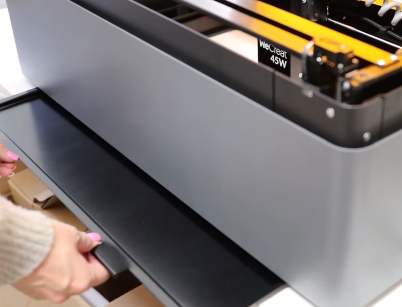 Add tray to the bottom of the laser.