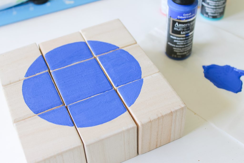painted blue circle on wooden blocks