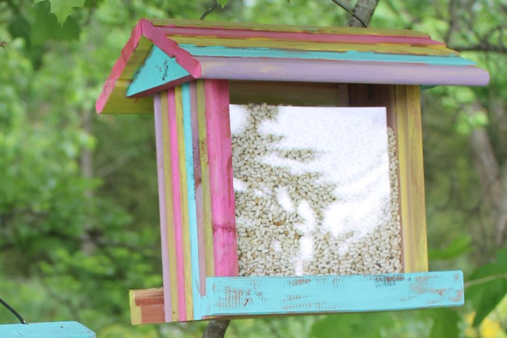 painted bird feeder with dry brushing
