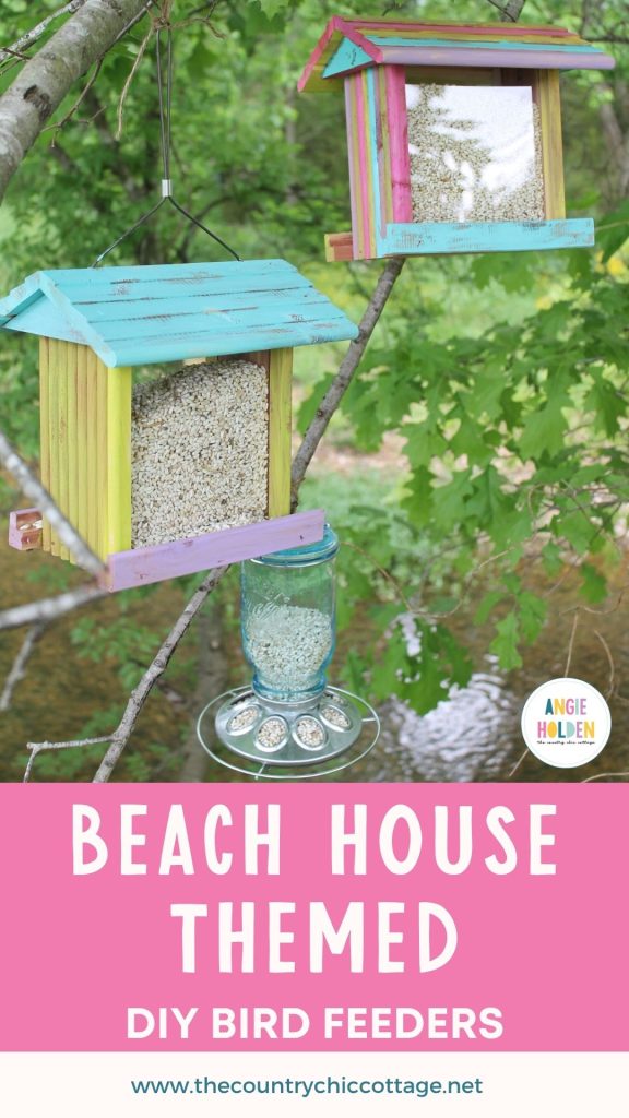 painted bird houses handing outside